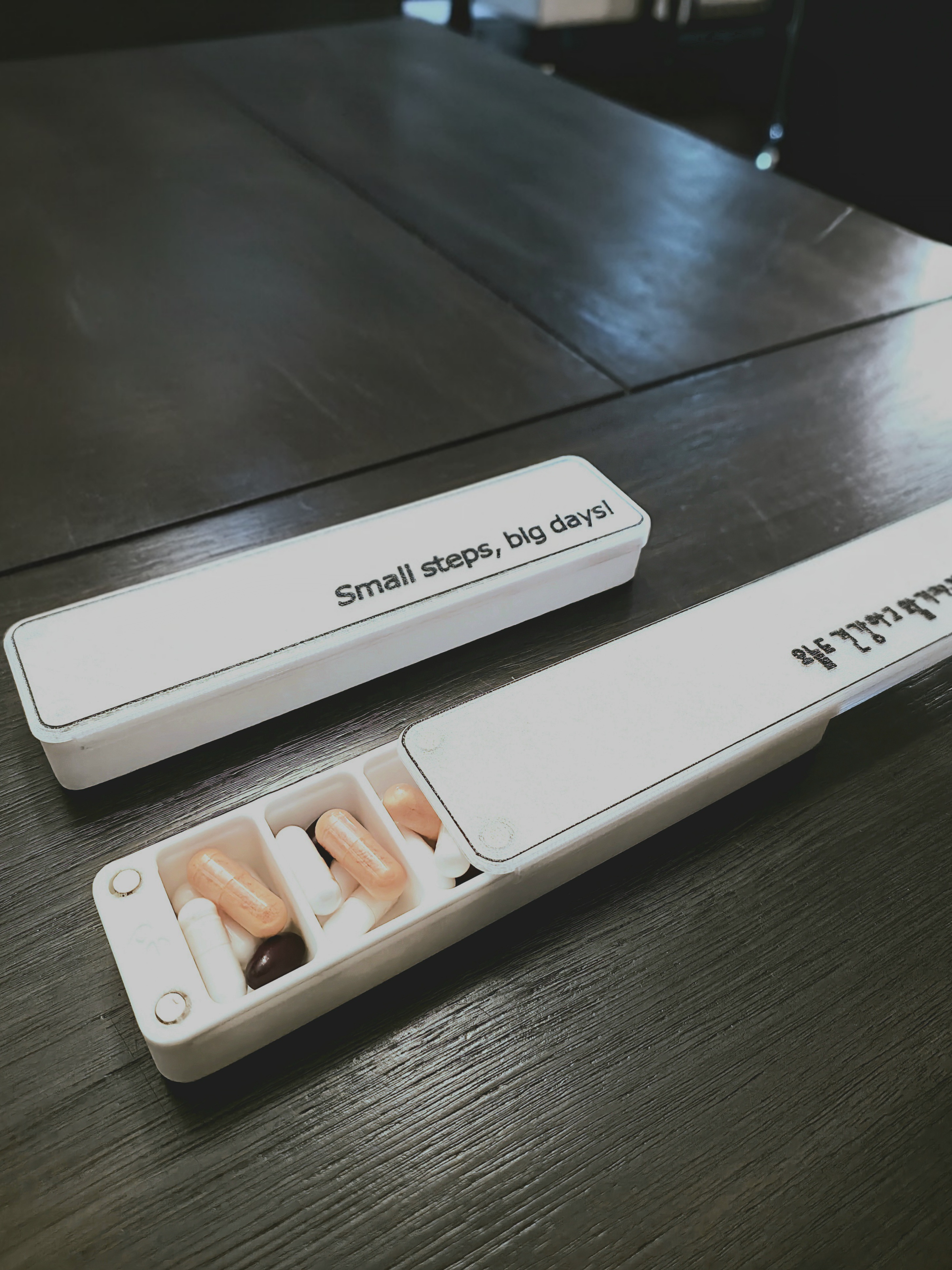 Pill box with sliding lid